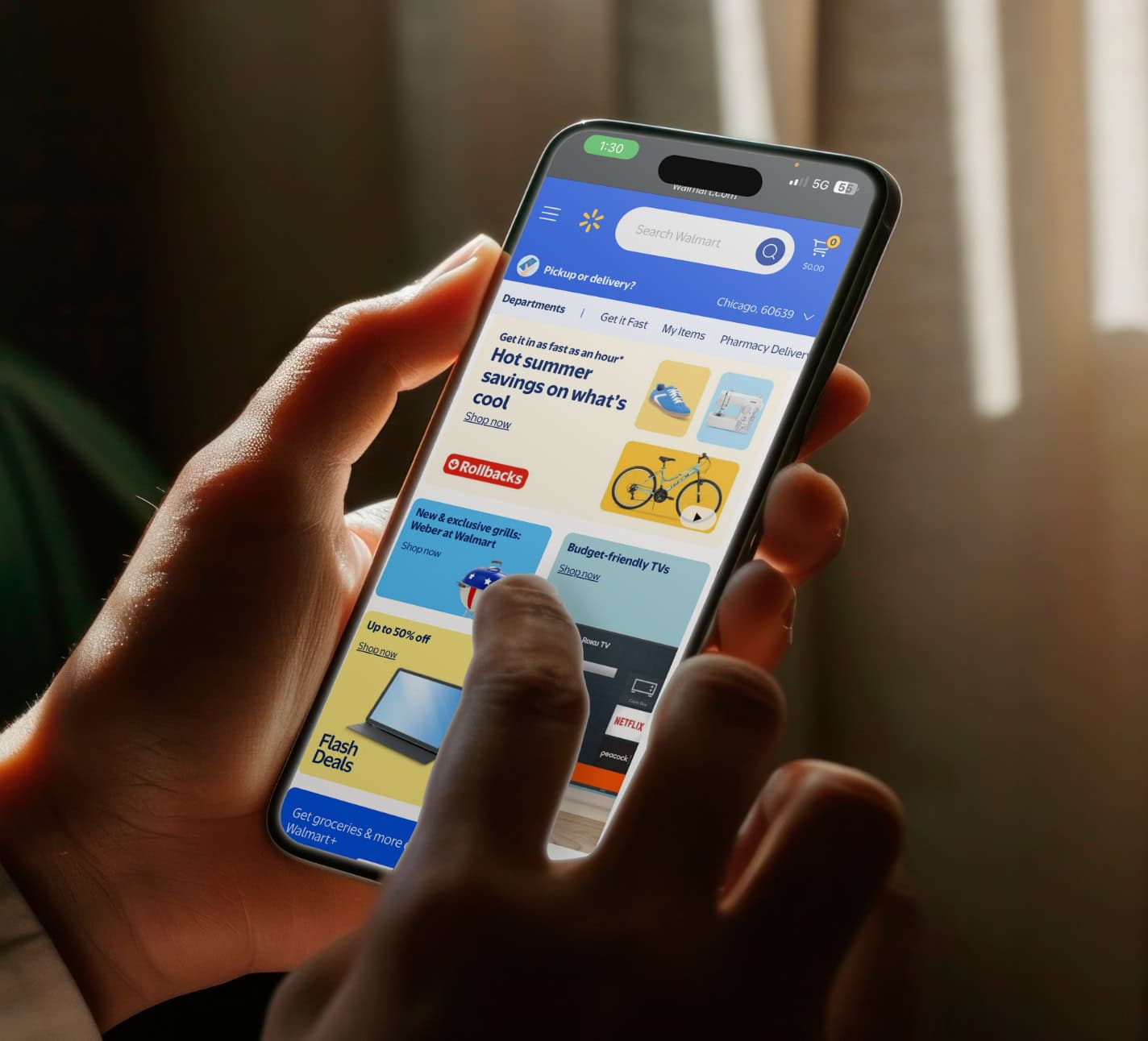 Walmart mobile shopping app displayed on smartphone screen, showing deals on electronics and other products.