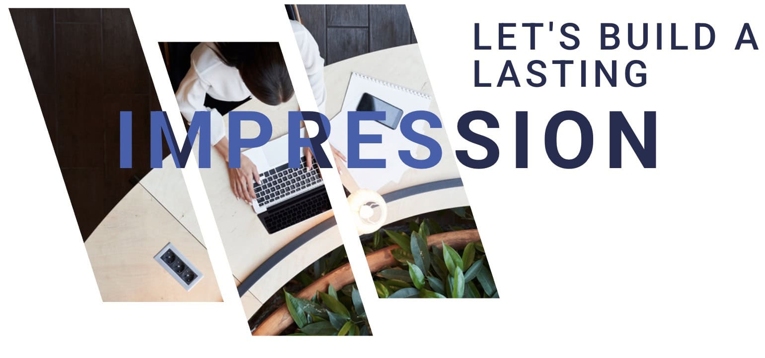 Laptop on desk viewed from above, greenery and office setting, modern workspace for content creation.