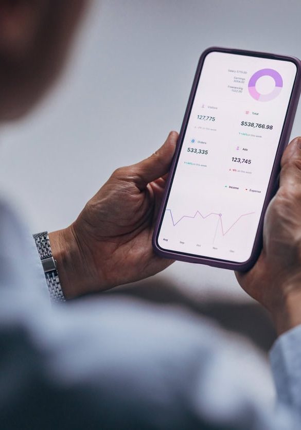 Analytics dashboard on a mobile phone screen in a marketing agency.